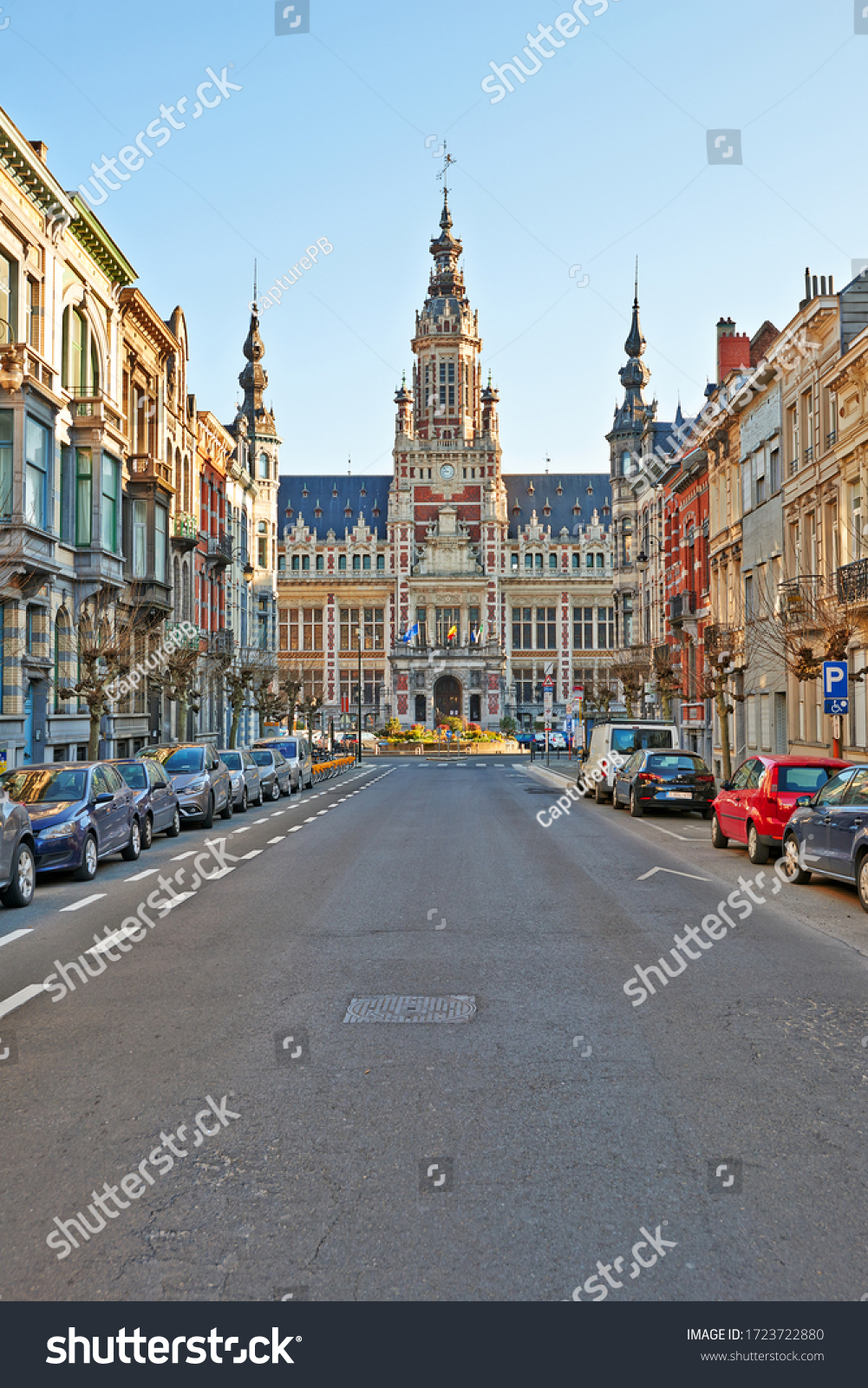 Brussels, Belgium - April 05, 2020: The Royal Saint-Marie street and the communal house at Schaerbeek without any people during the confinement period. #1723722880