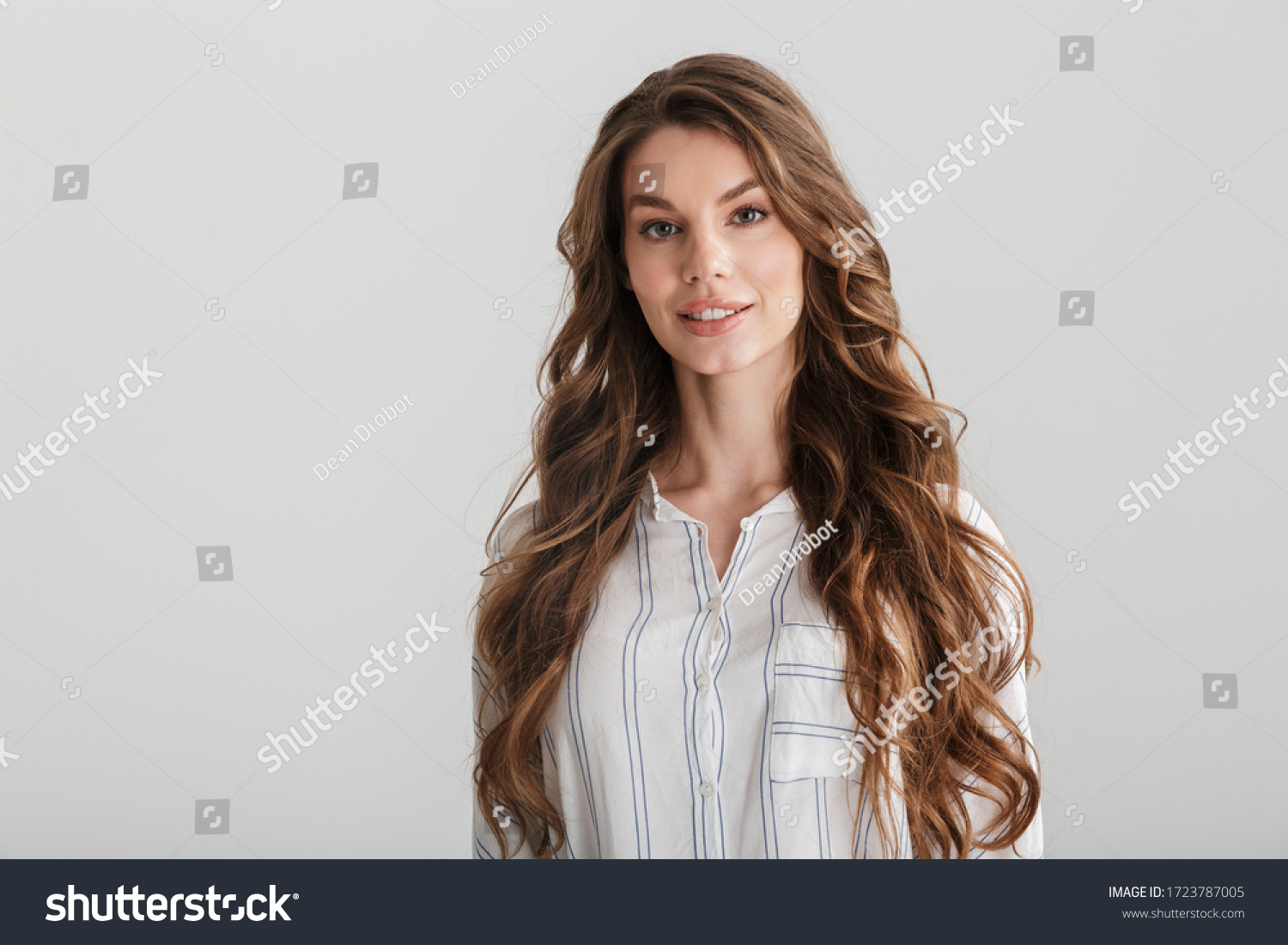 Image of confident caucasian woman posing and looking at camera isolated over white background #1723787005