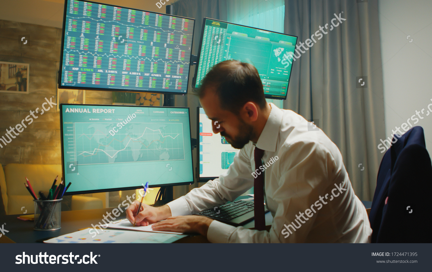 Stock market trader pointing at monitor computer and taking notes. Financial crash. #1724471395