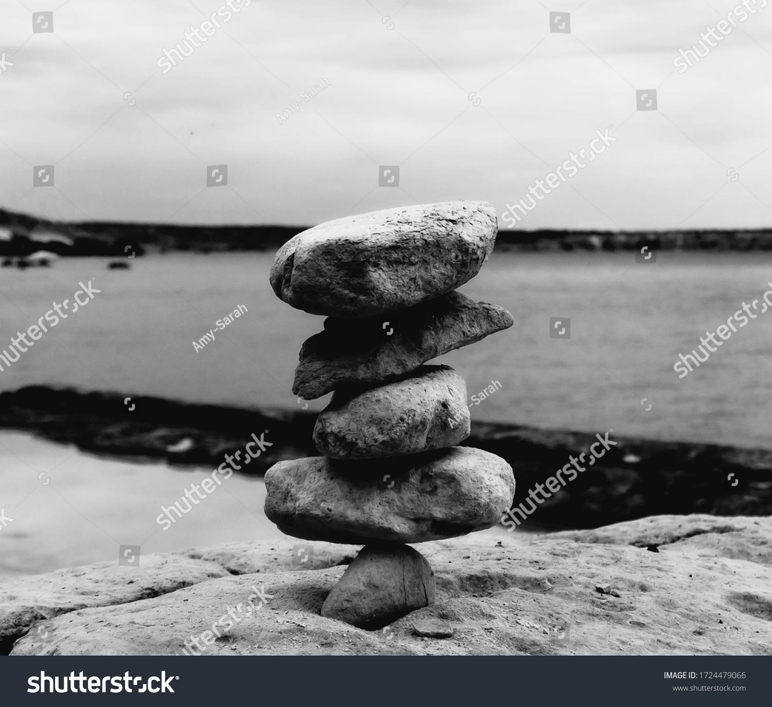  Black and White Background Tower of Rocks #1724479066
