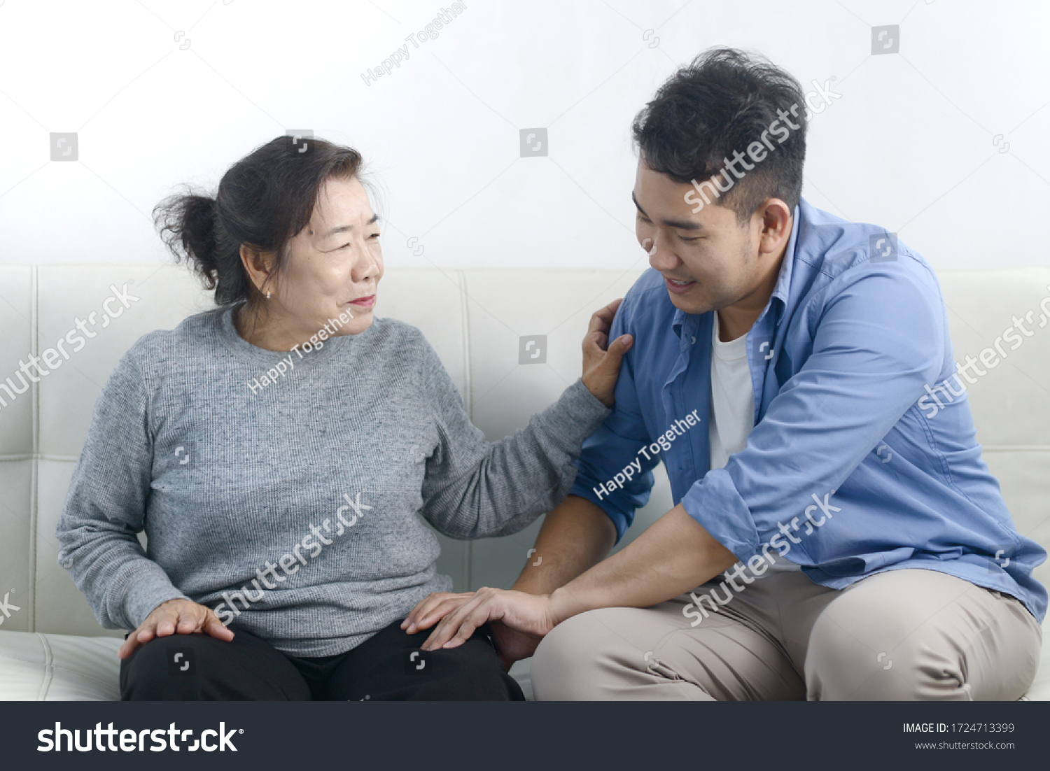 Asian man massage his mother at home, lifestyle concept. #1724713399