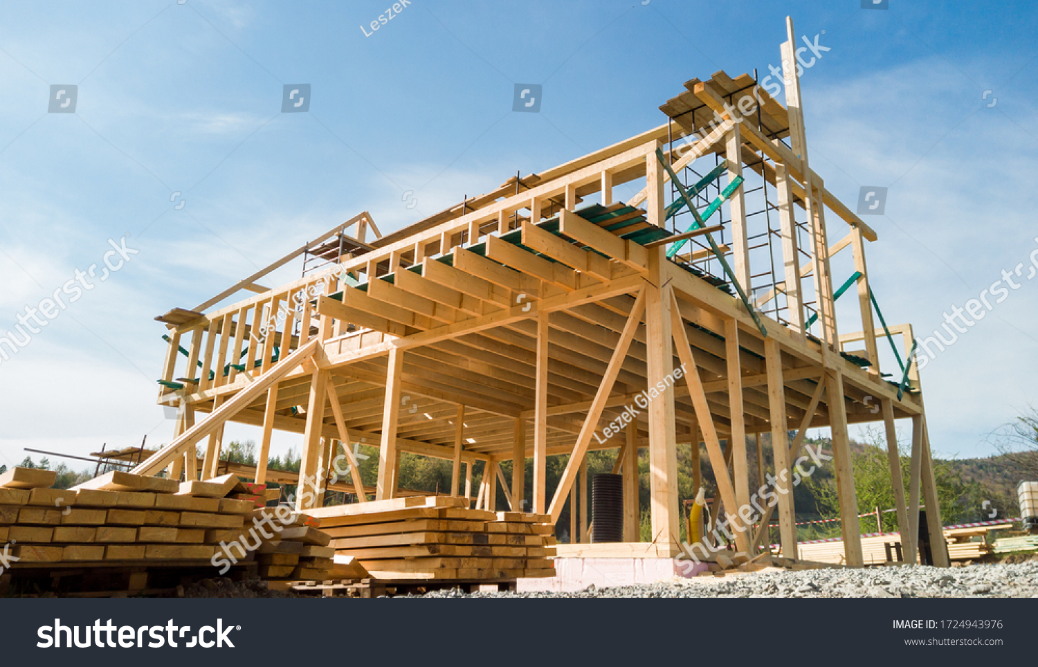 Framing of a new wooden house under construction #1724943976