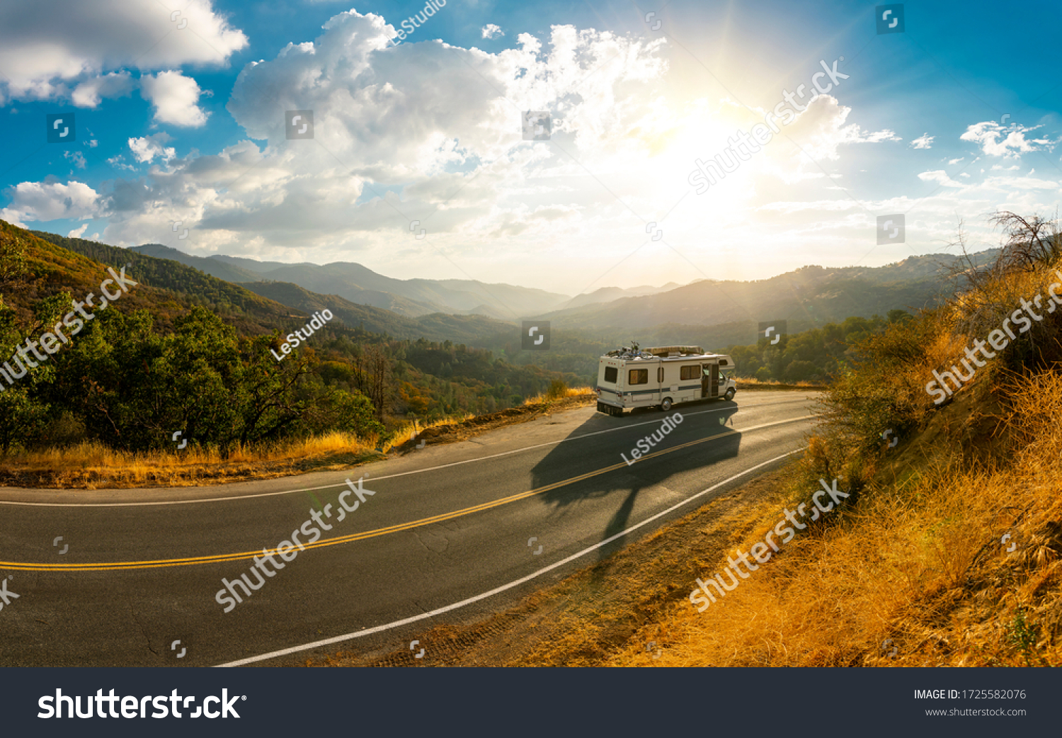 Epic nature mountain view with a road side parked RV motorhome. Travelling lifestyle roadtrip adventure in the USA #1725582076