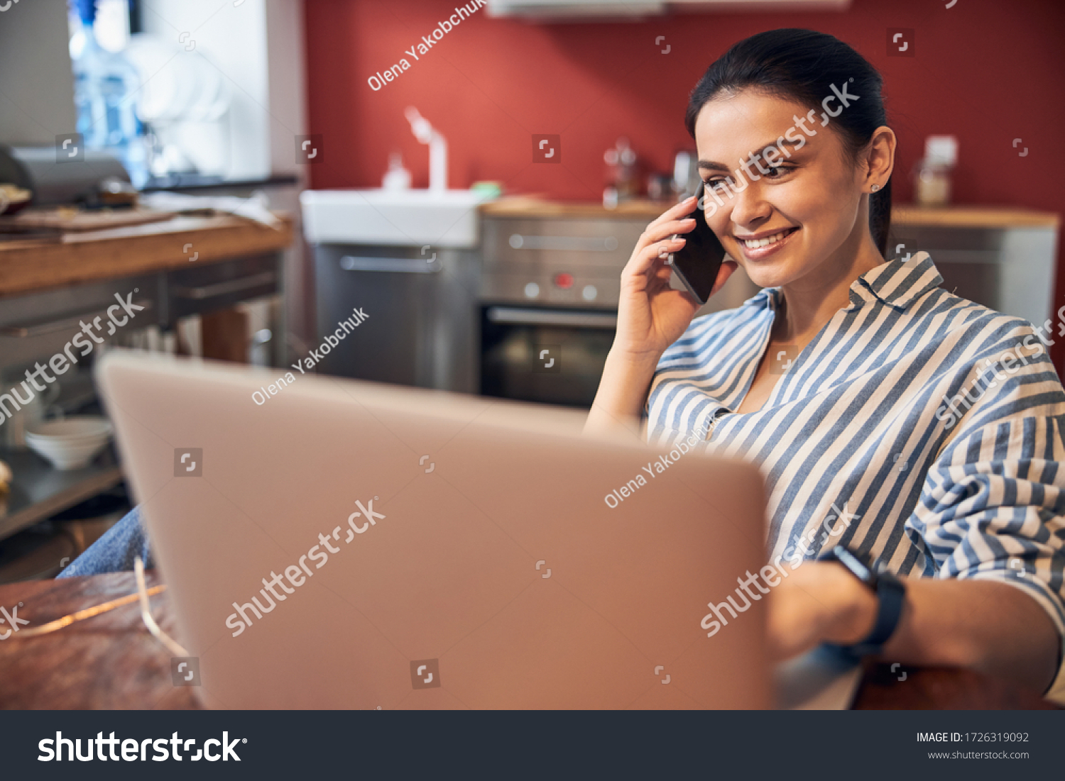 Busy Caucasian girl using her digital devices at workplace stock photo. Modern technology concept #1726319092