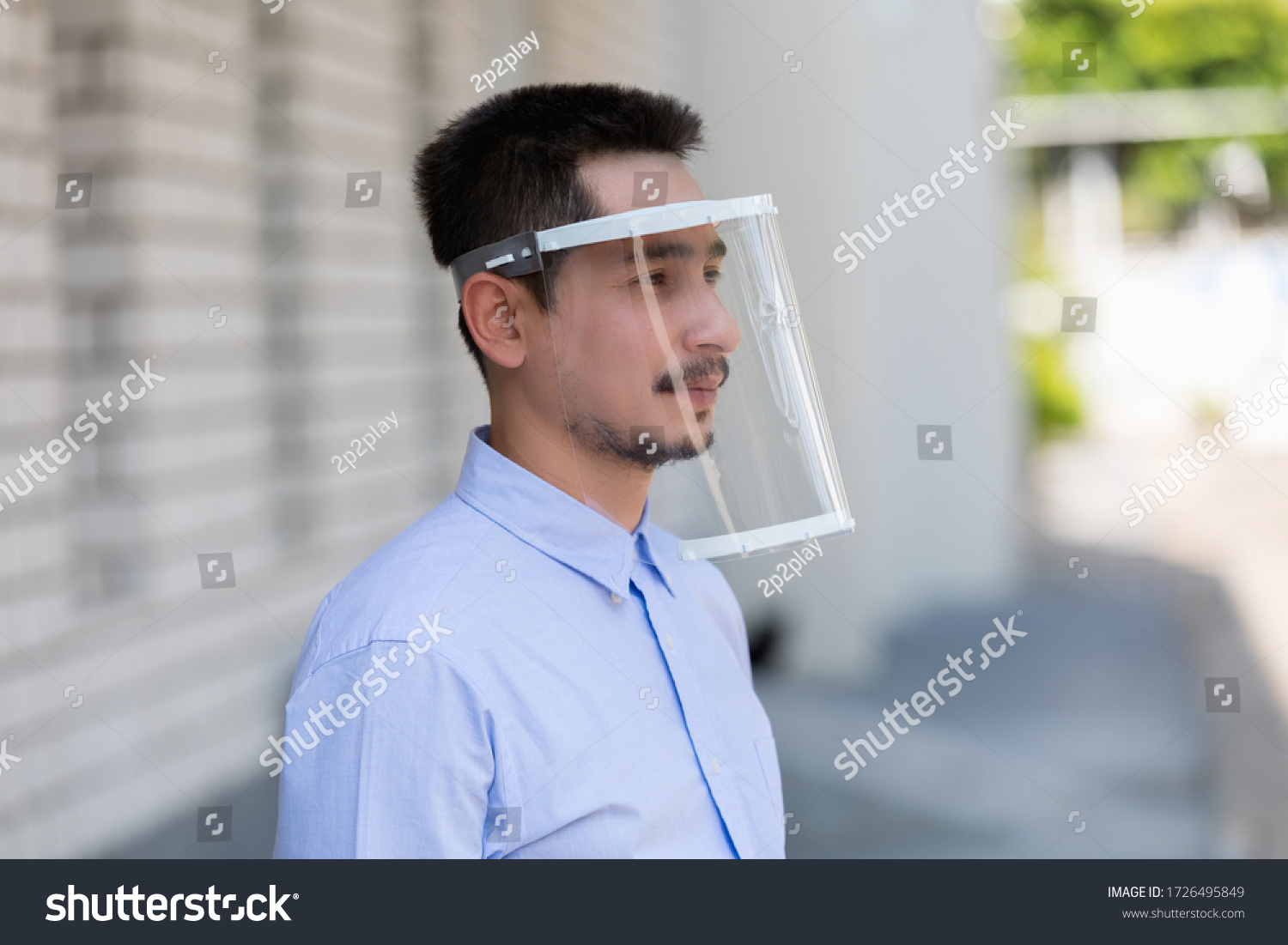 Asian young man wearing face shield for healthcare which is required for doctor and general public to prevent COVID-19. #1726495849