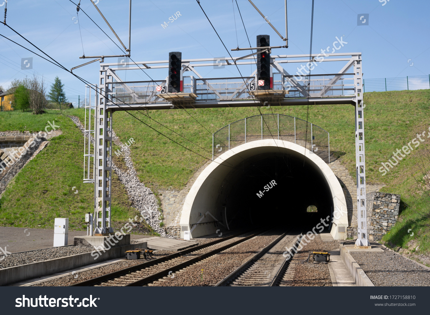 Railway and railroad track is goint into dark and long tunnel. Infrastructure building and underground passageway. #1727158810