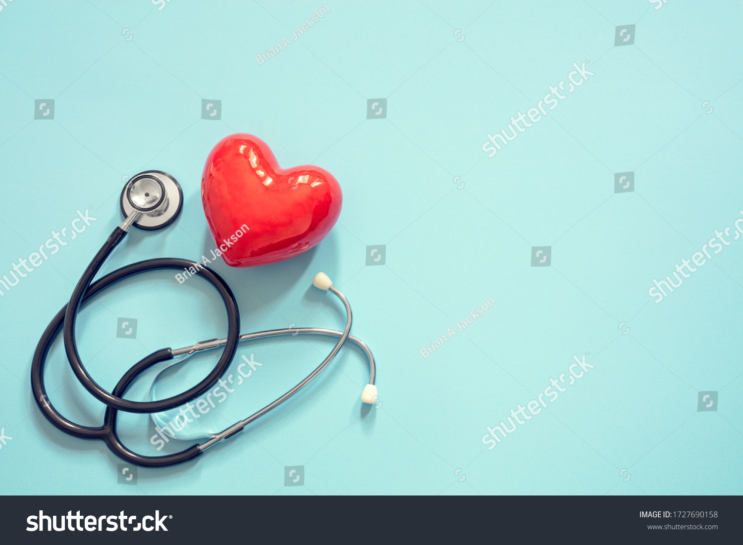 Heart and stethoscope isolated onblue background concept for healthcare and diagnosis medical cardiac pulse test #1727690158