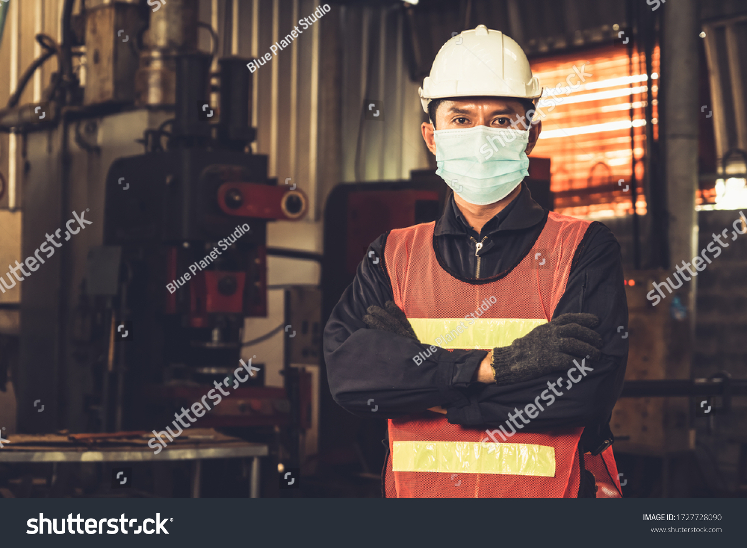 Factory workers with face mask protect from outbreak of Coronavirus Disease 2019 or COVID-19. Concept of protective action and quarantine to stop spreading of Coronavirus Disease 2019 or COVID-19. #1727728090