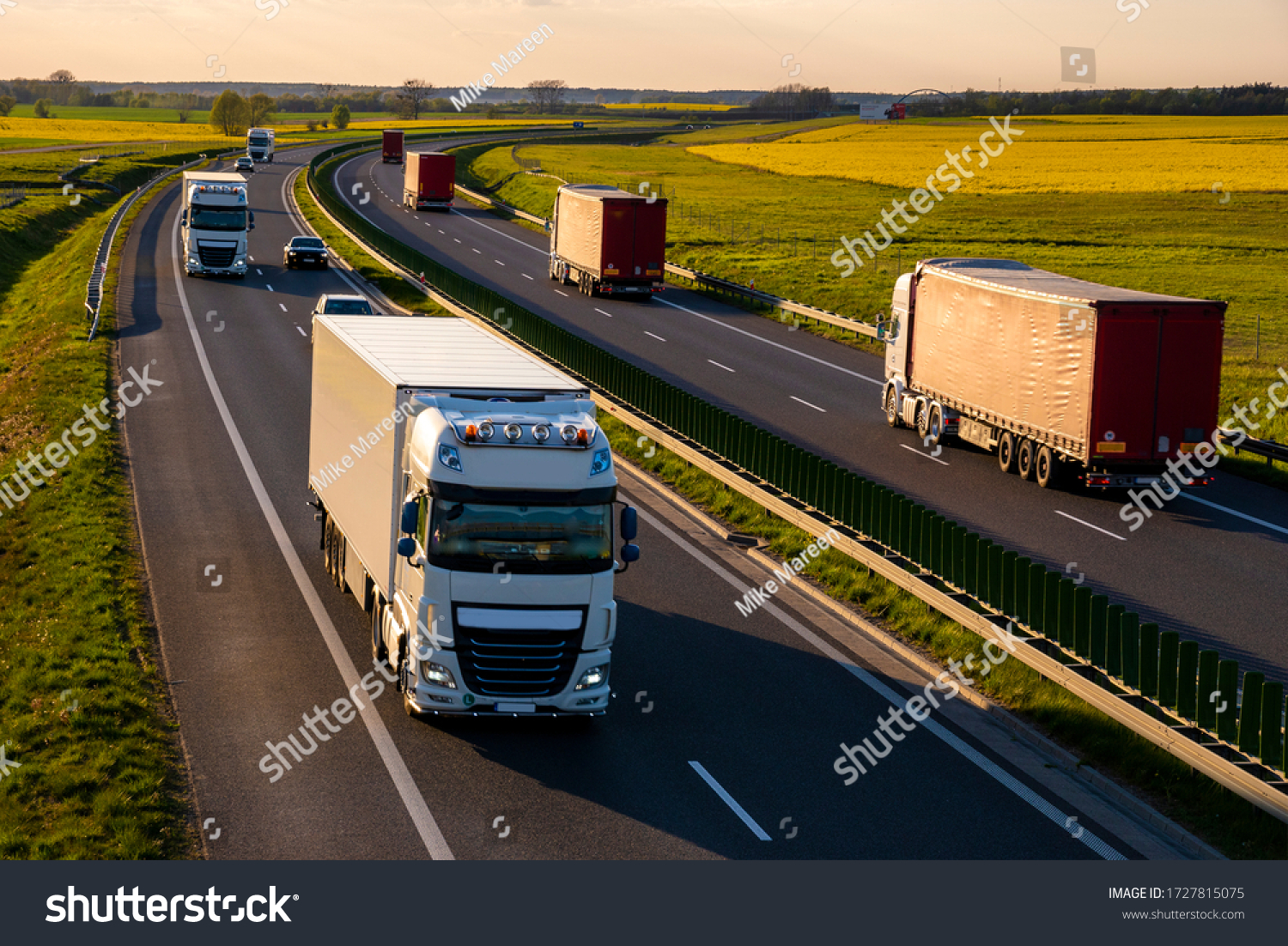 heavy truck traffic on the highway in the evening #1727815075