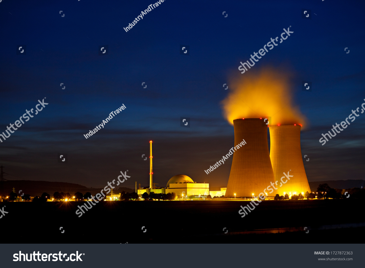 Night shot of a nuclear power plant close to a river with blue night sky. #1727872363