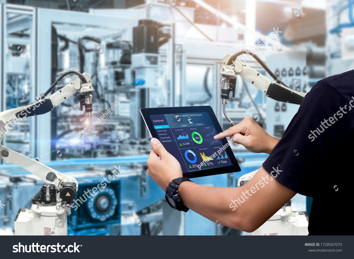 Smart industry control concept.Hands holding tablet on blurred automation machine as background #1728567073
