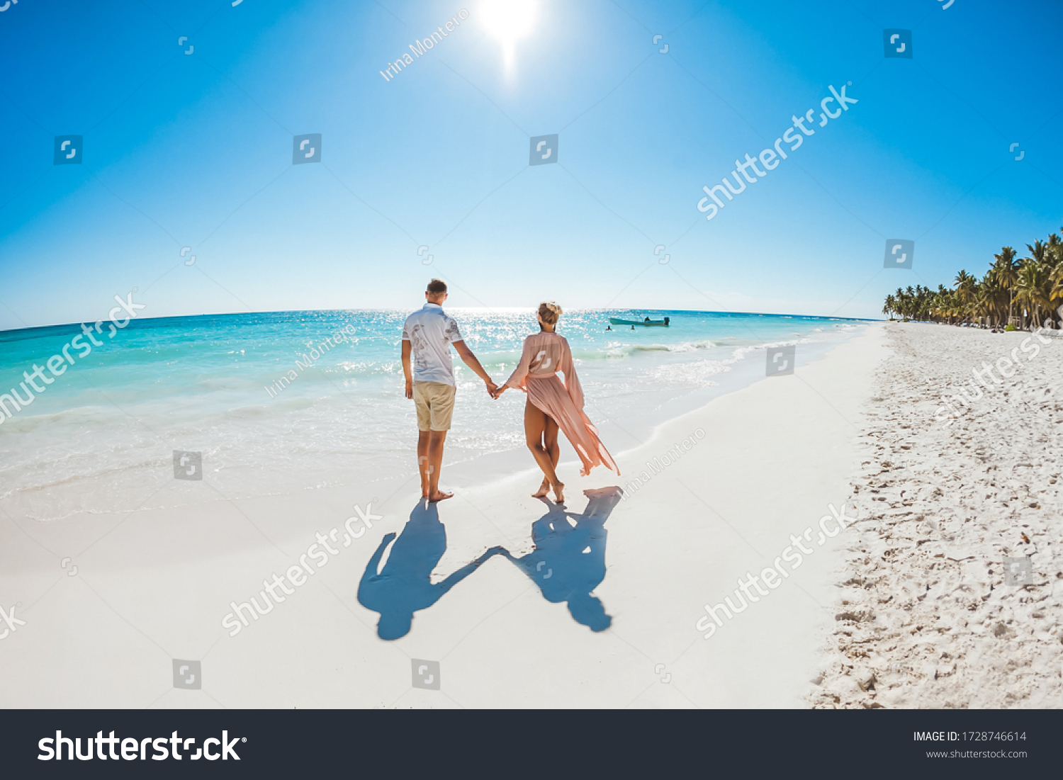 Romantic couple in love hugging, kissing and running on the sandy tropical Caribbean beach in Dominican republic landscape   #1728746614