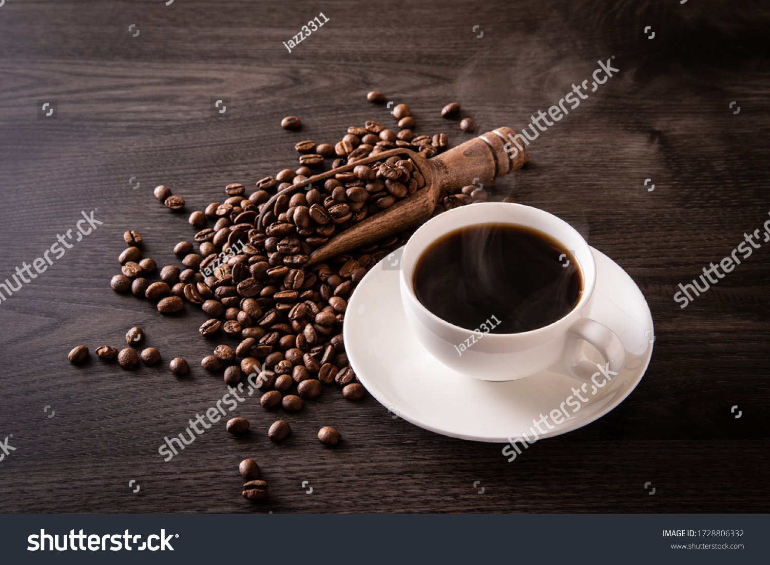 Coffee beans and hot coffee on the table #1728806332