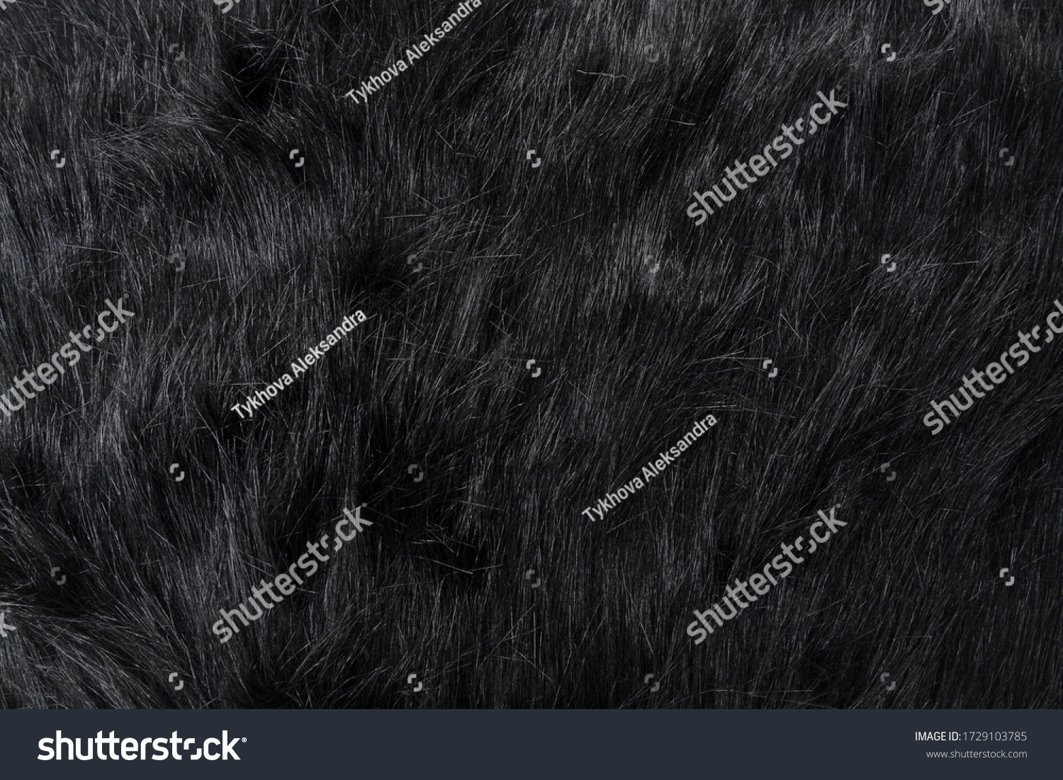 Long black fur of a bear or dog. Faux fur fabric. Artificial fur fabric texture, useful as background #1729103785