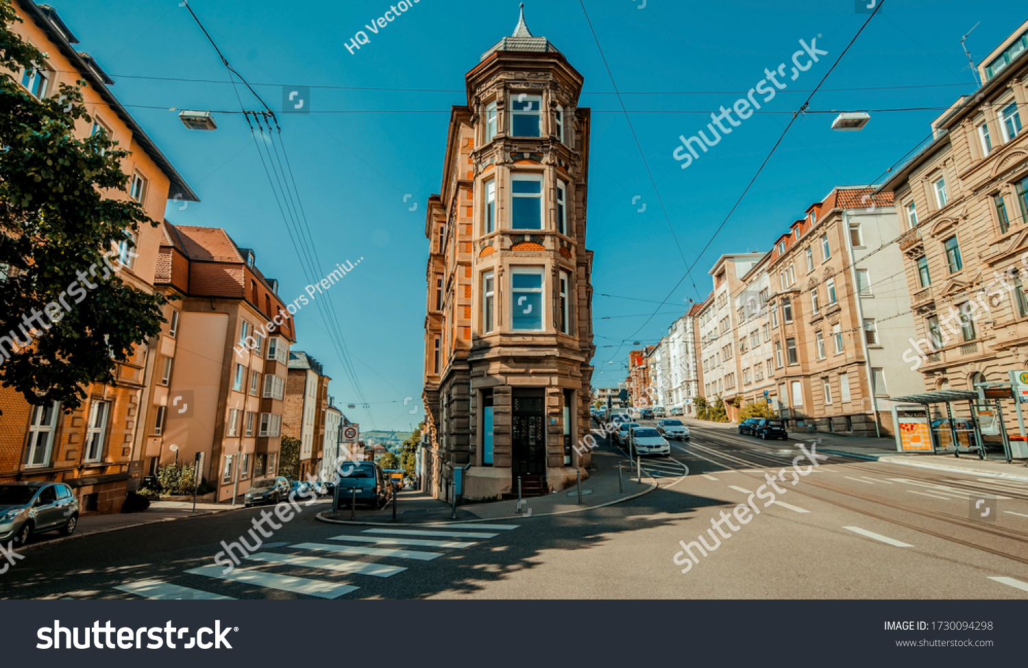 Stuttgart, Germany, June, 2015, Flat building in center of street inside stuttgart city at Eugensplatz square, a popular meeting place for people. Architecture reminding of flatiron building in New Yo #1730094298