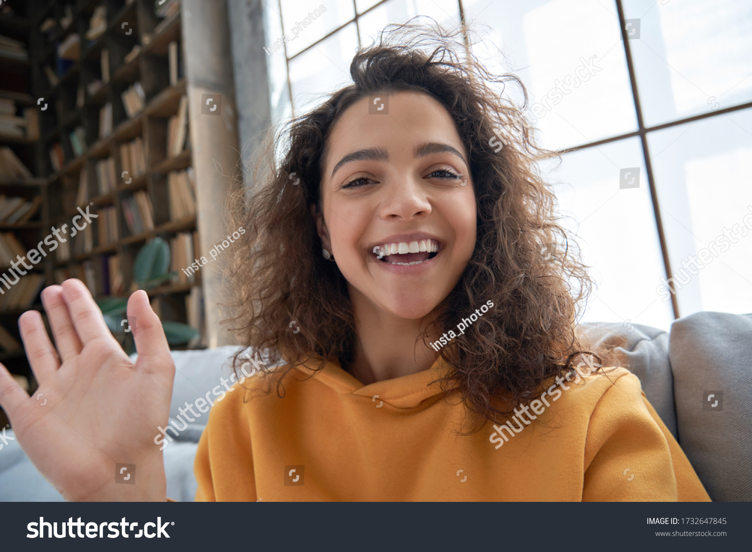 Happy hispanic latin gen z teen girl blogger smiling face waving hand talking to webcam recording vlog, social media influencer streaming, making video call at home. Headshot portrait. Webcamera view #1732647845