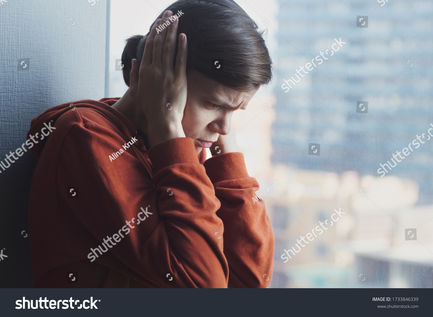 mental health, stress, migraine or depression concept, young sad depressed frustrated autistic woman sitting at home alone suffering from head ache and psychological problems #1733846339