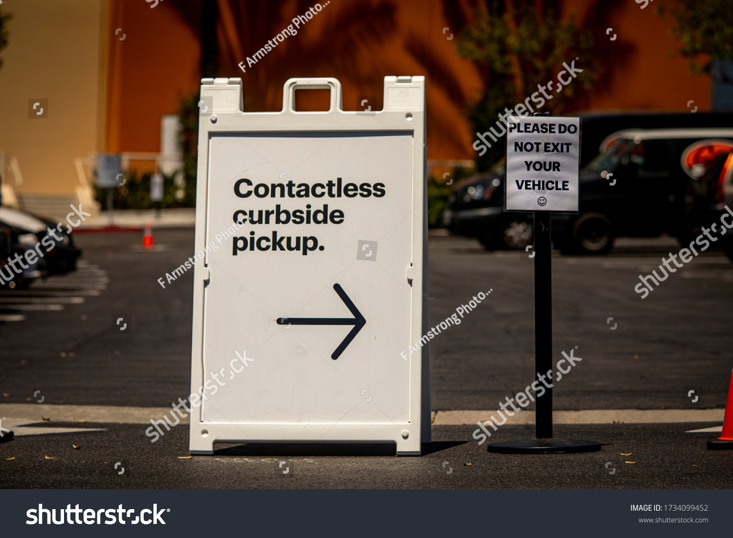 Sign advertising Contactless Curbside Pickup at retail store parking lot #1734099452