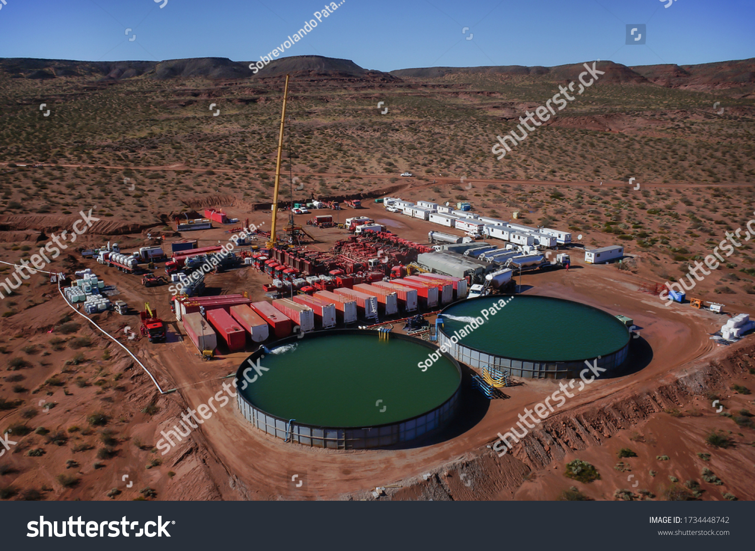 Vaca Muerta, Argentina, August 26, 2014: Extraction of unconventional oil. Battery of pumping trucks for hydraulic fracturing (Fracking). #1734448742