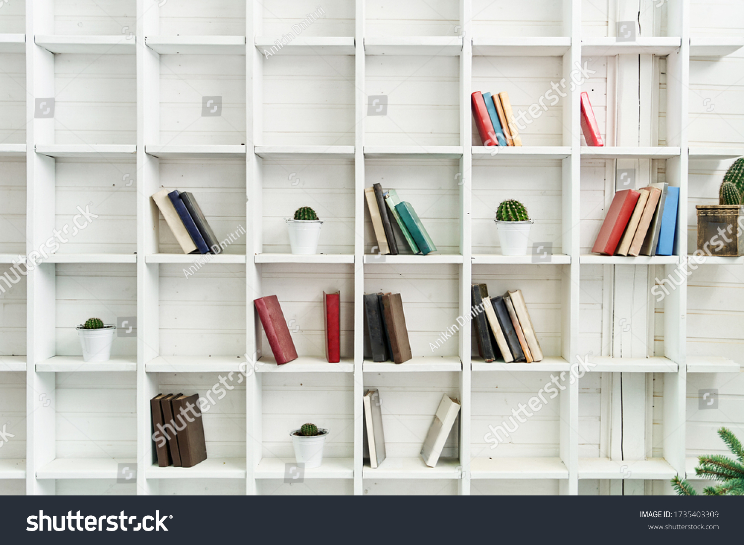 White wooden shelves with old books. Wooden bookcase. #1735403309