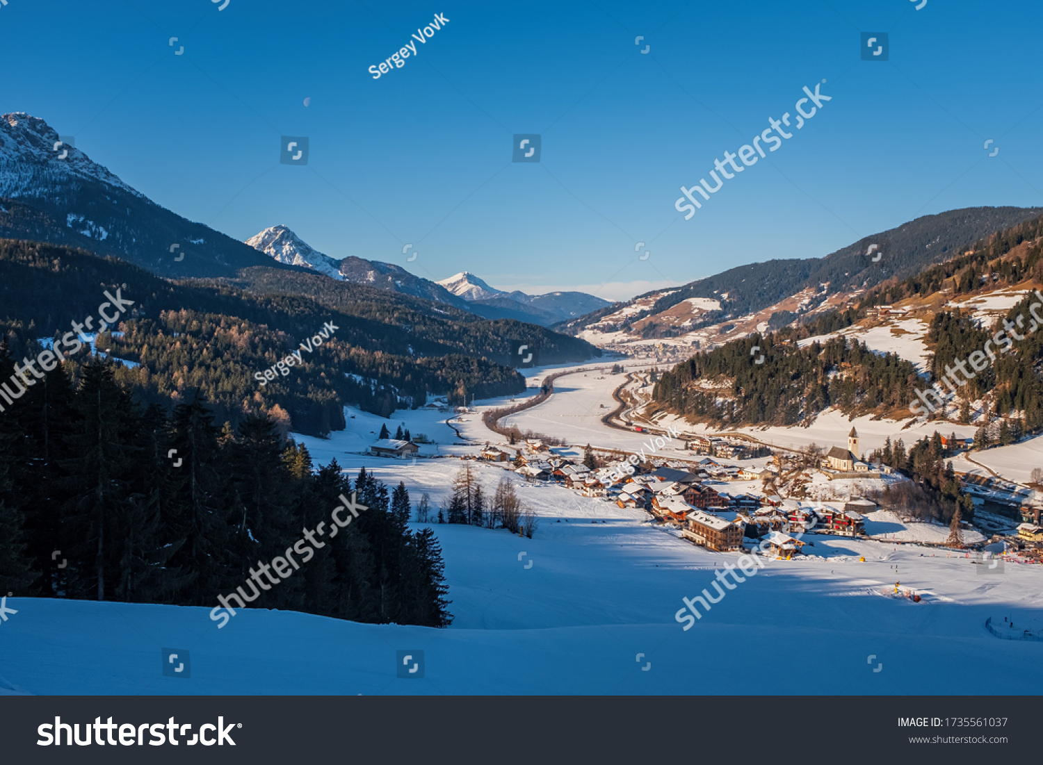 Winter landscape in Tre Cime Dolomiti, or Drei Zinnen Dolomites. Monte Elmo Sesto , Italy. January 2020. Top view on San Candido. #1735561037
