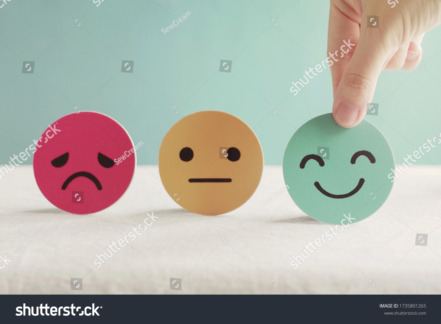 Hand choosing happy smile face paper cut, good feedback rating and positive customer review, experience, satisfaction survey ,mental health assessment, world mental health day concept