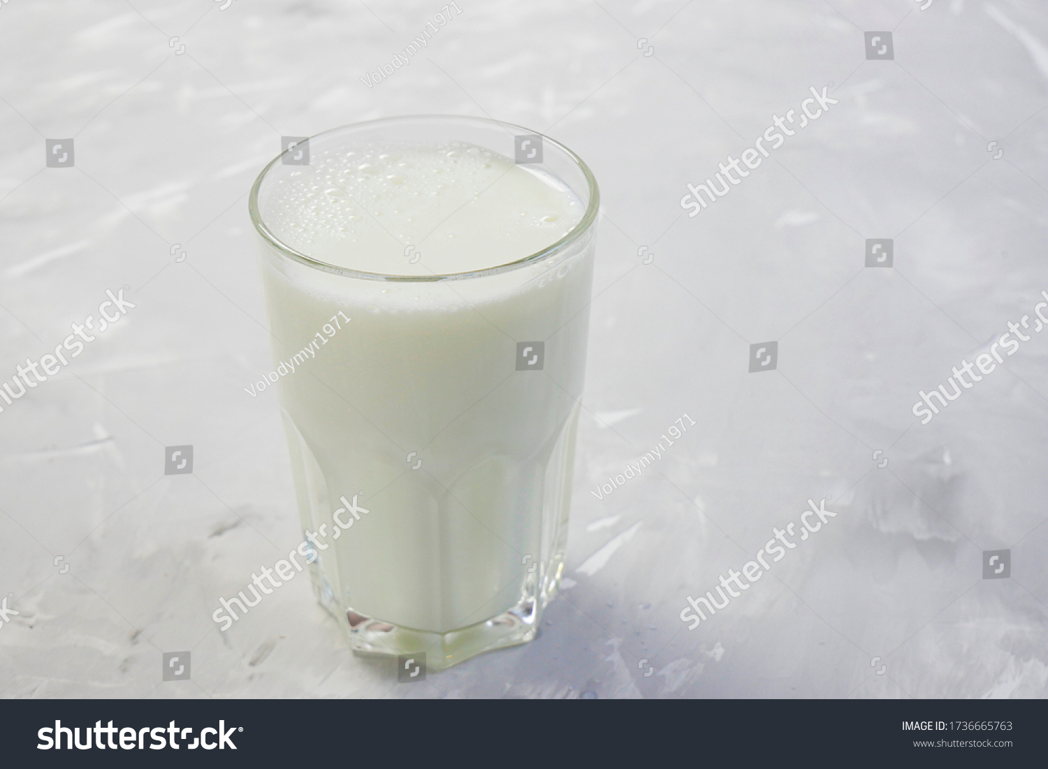 Tasty fresh milk on a white wooden background. a glass of milk. copy space #1736665763