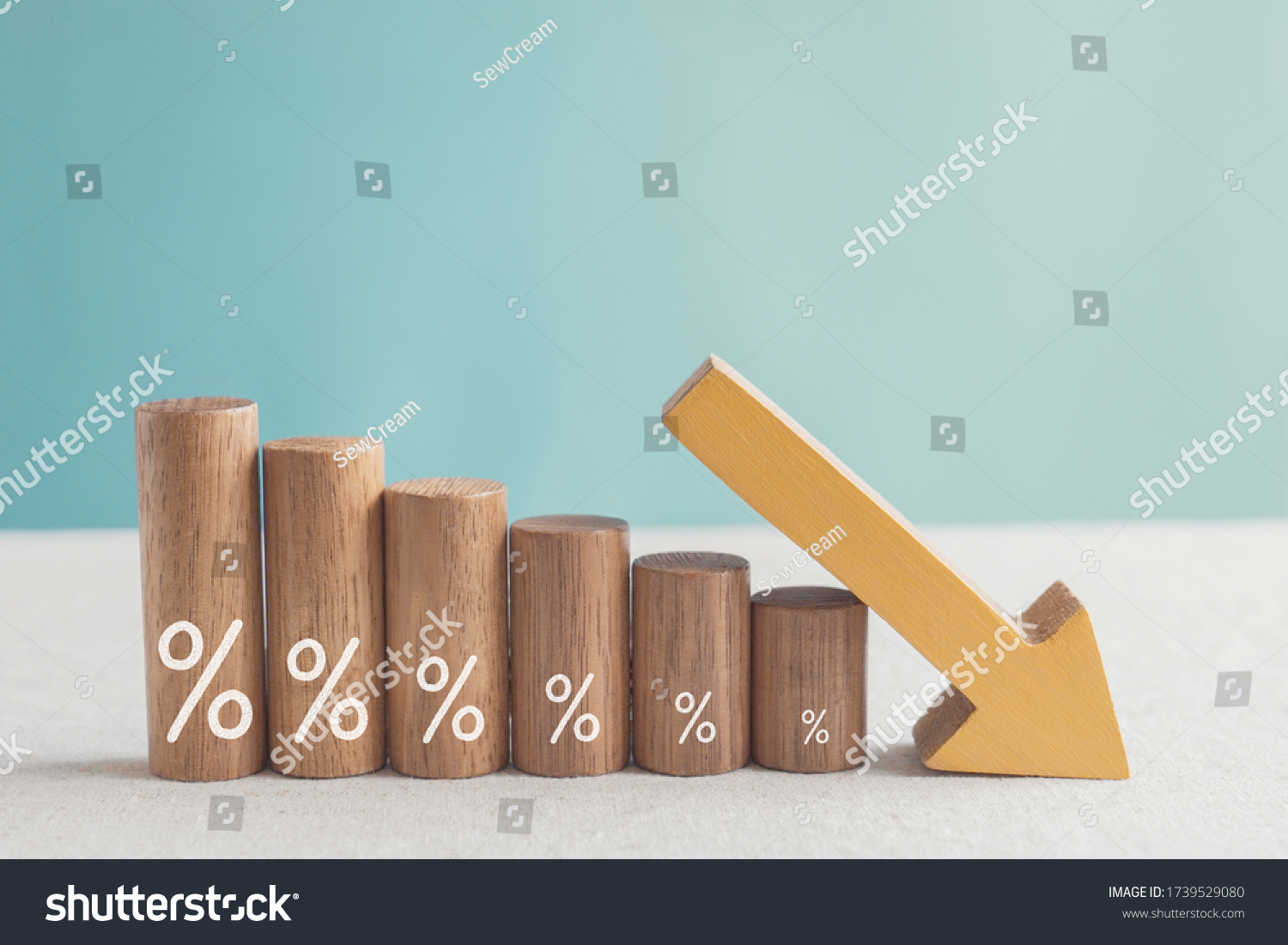 Wooden blocks with percentage sign and down arrow, investment reduce, financial recession crisis, interest rate decline, risk management concept #1739529080