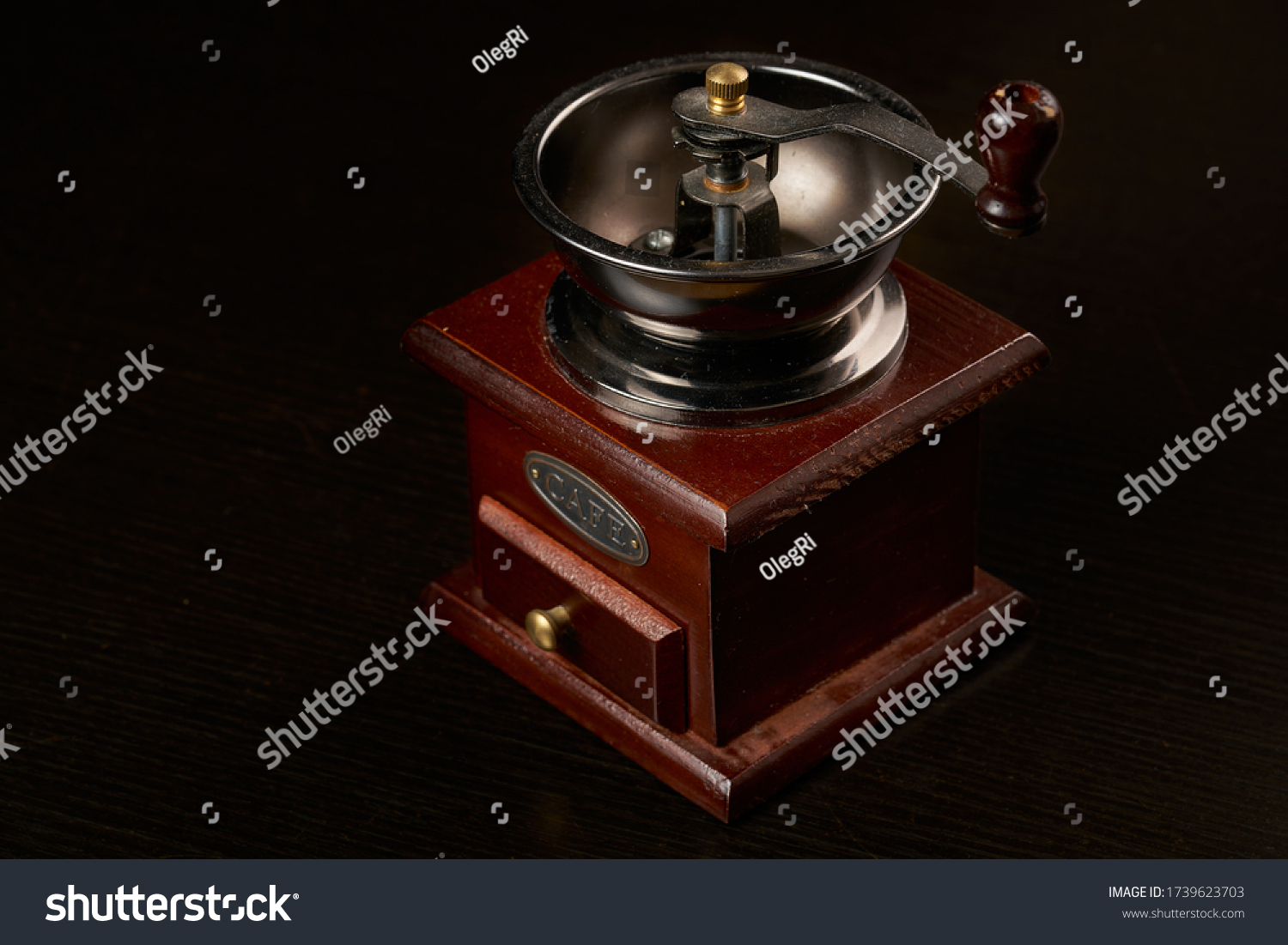 Manual coffee grinder for grinding coffee beans. Black background. Vintage coffee grinder #1739623703