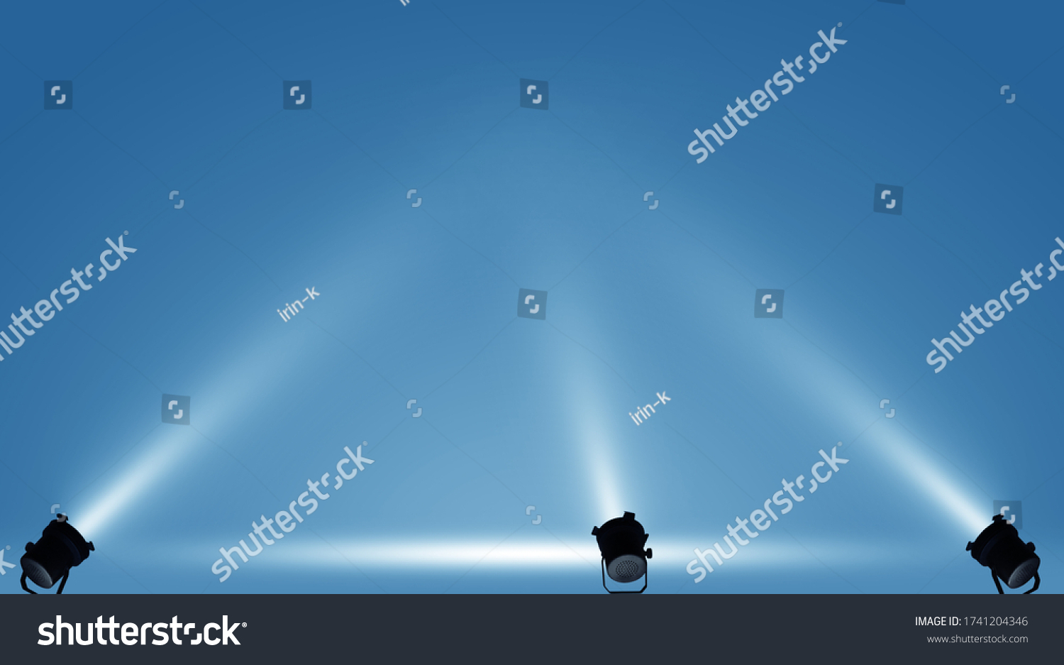 Spotlights illuminate empty stage blue background. #1741204346