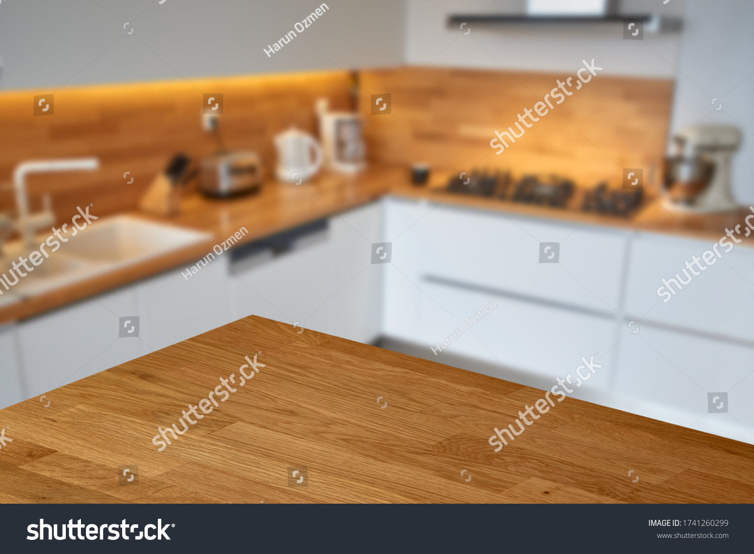 Empty wooden table or countertop top corner with blurred white modern kitchen background.  #1741260299