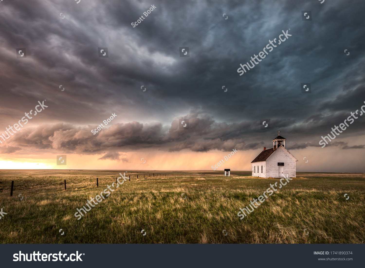 A severe thunderstorm approaches an old abandoned church in the countryside during the late afternoon in Colorado.  #1741890374