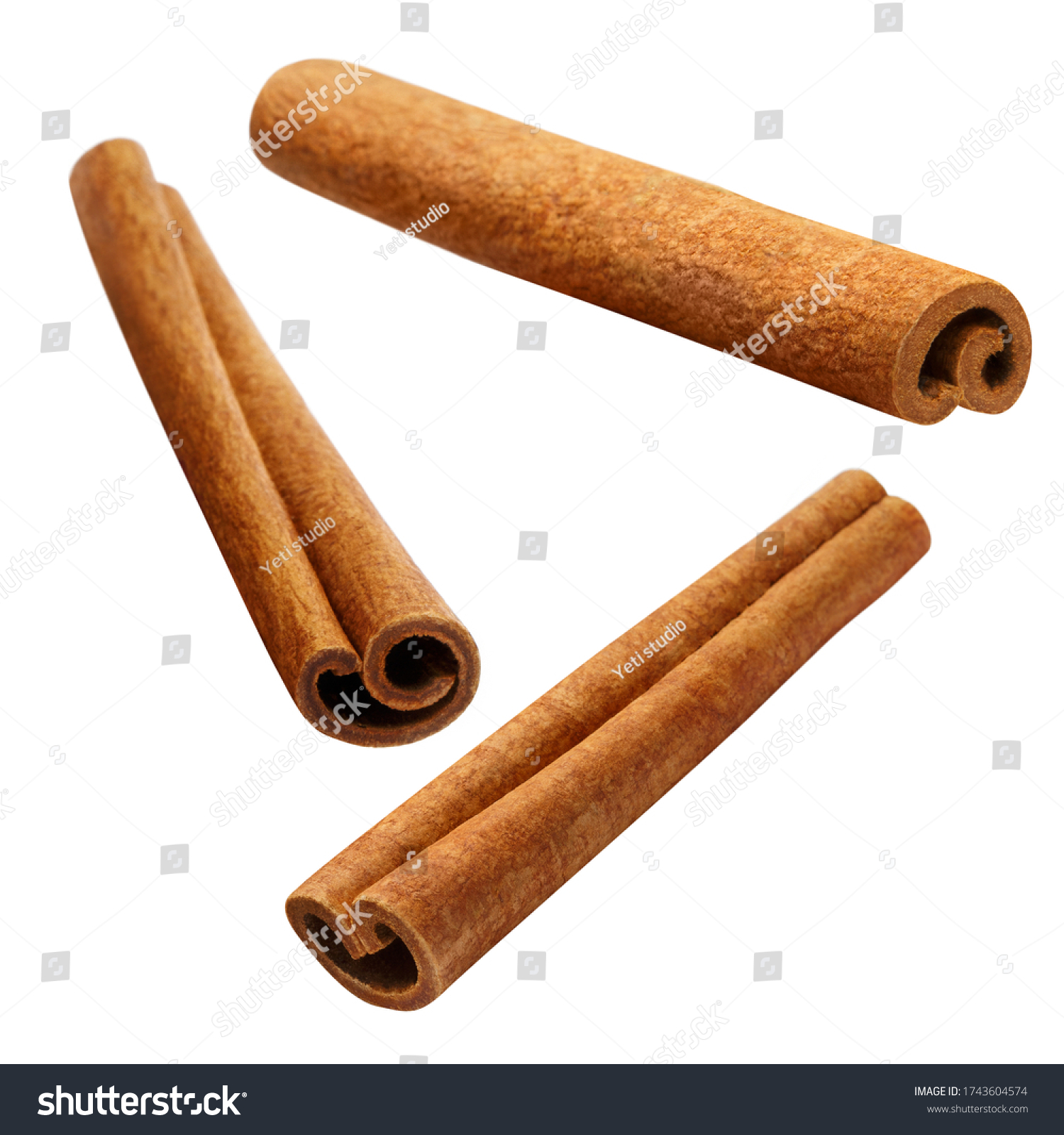 Flying delicious cinnamon sticks, isolated on white background #1743604574