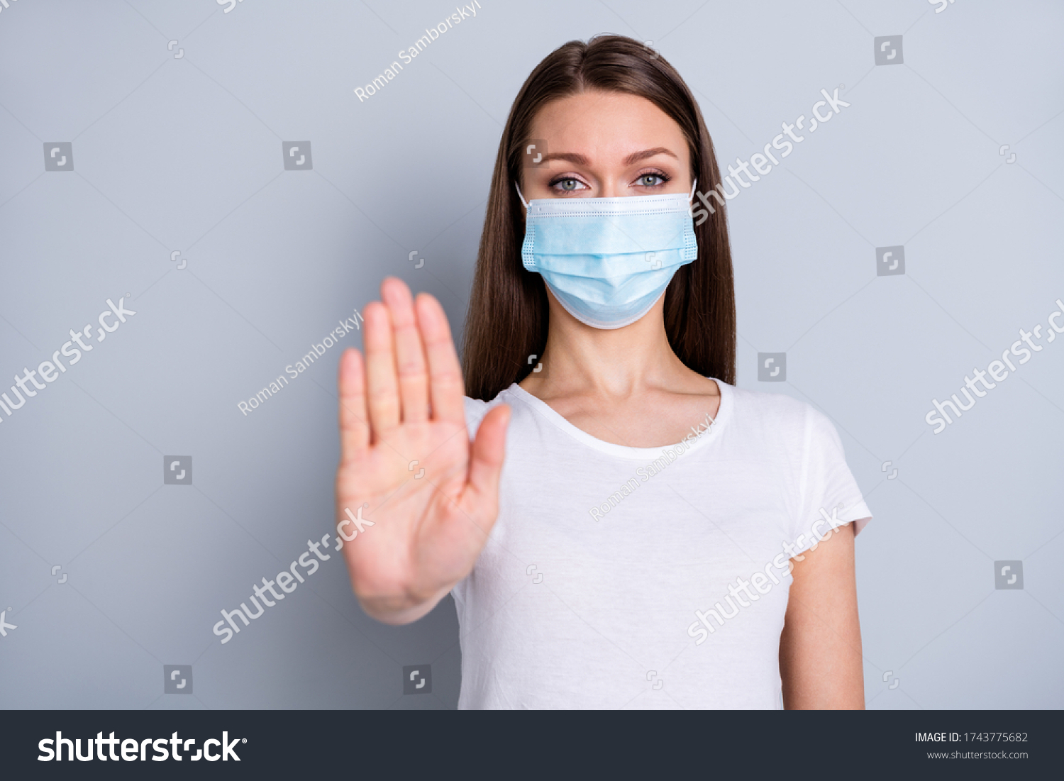 Photo of pretty serious lady keep social distance avoid people contacting hospital examination raise arm stand far away wear protect face mask t-shirt isolated grey color background #1743775682