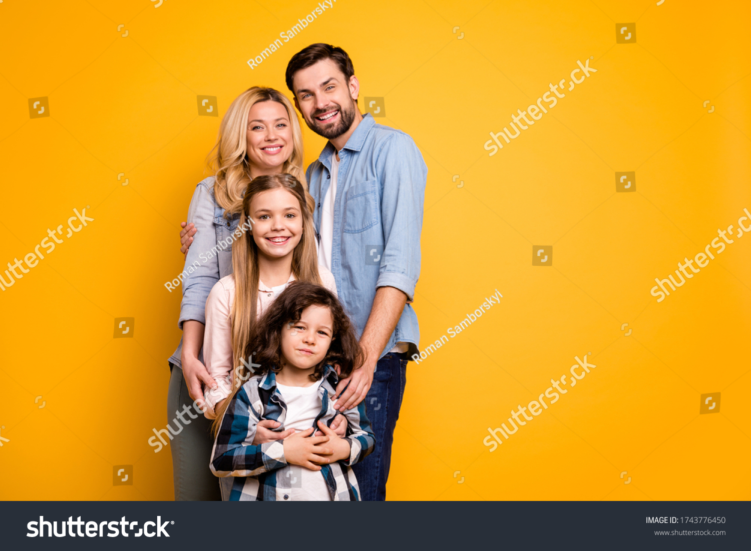 Photo wife mother lady handsome husband dad couple hug adopted little school girl daughter small son boy happy together wear casual shirts clothes isolated yellow color background #1743776450