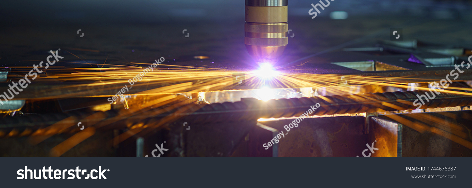 Plasma cutting machine cuts metal material with sparks #1744676387