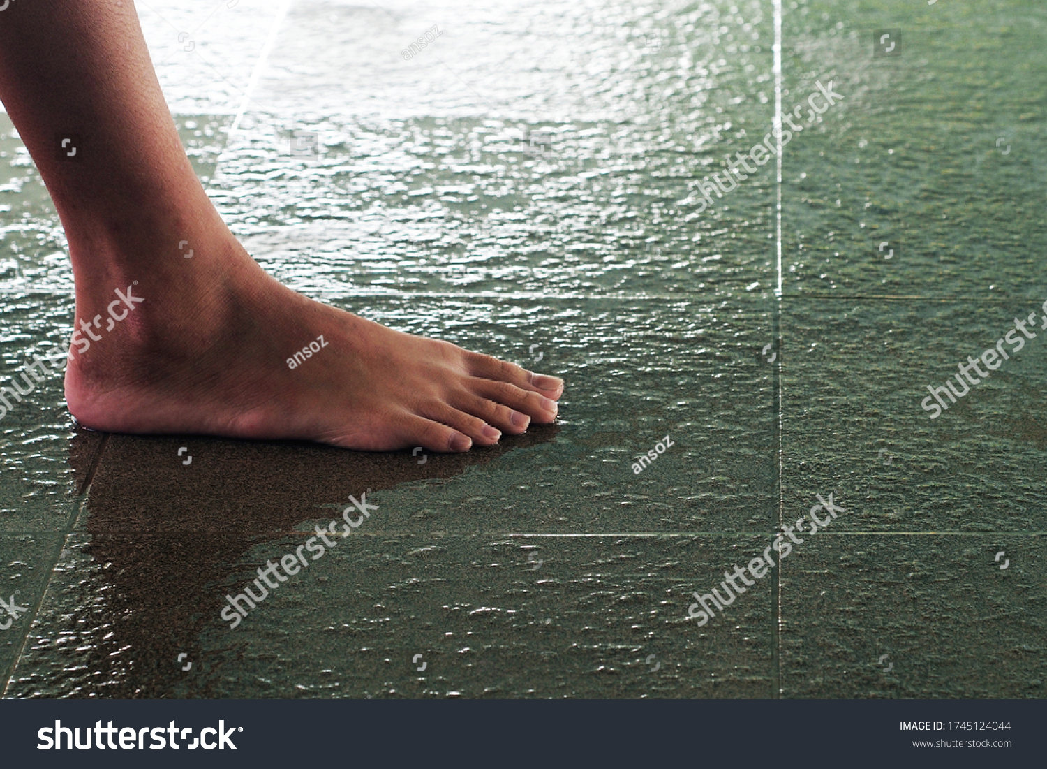 Non-slip floor tiles of the swimming pool with feet clipping path #1745124044