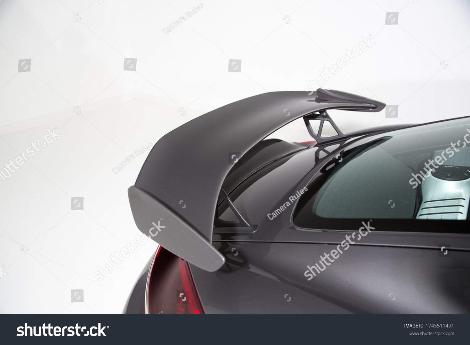 Close up of rear spoiler on sports car #1745511491