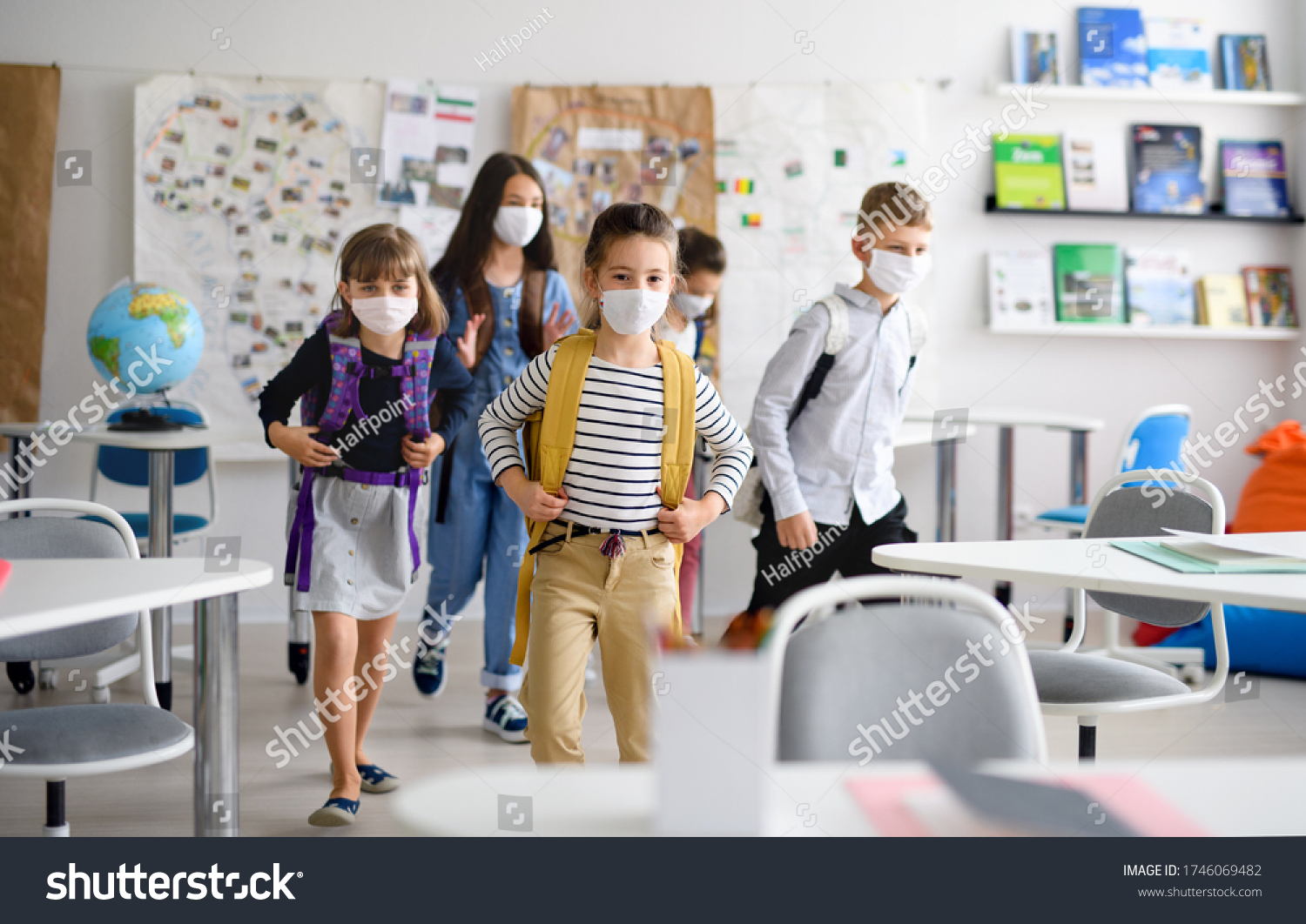 Group of children with face mask back at school after covid-19 quarantine and lockdown. #1746069482