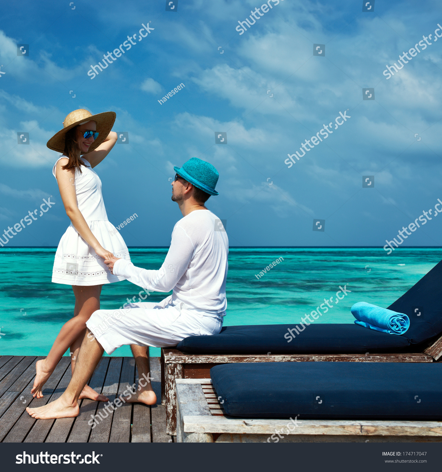 Couple on a tropical beach jetty at Maldives #174717047