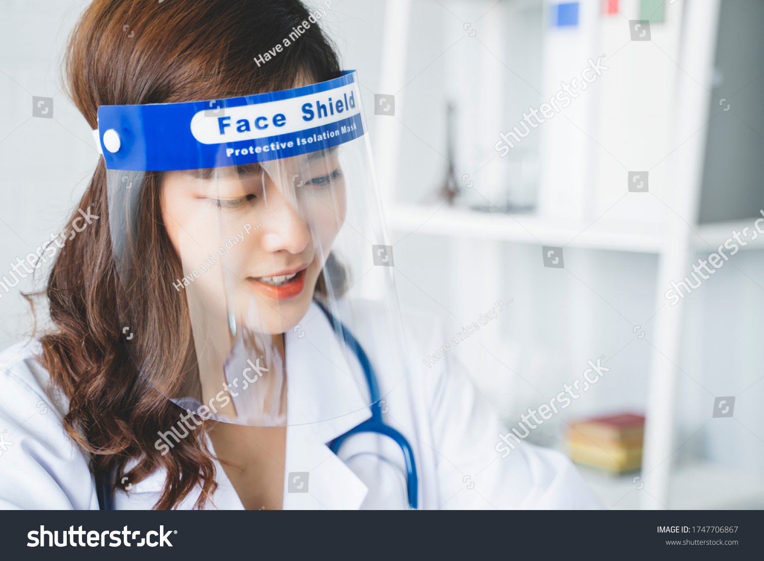 Medical healthcare beautiful Asian doctor wearing face shield mask protection from infectious disease virus bacteria germs coronavirus covid-19, safety protection working in hospital modern office  #1747706867