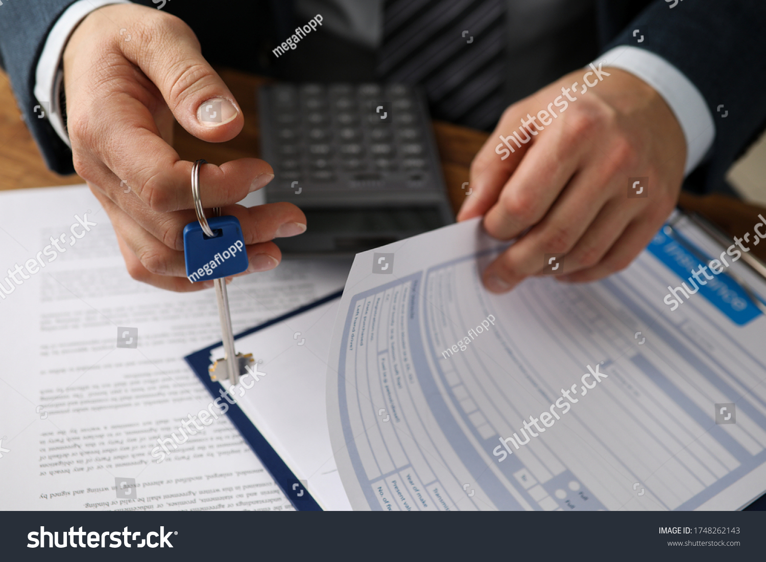 Man in suit prepares document for rental property. Registration home and property insurance policy. Homeowner is housing company. Duty to pay monthly rent on time. Housing system in turn #1748262143