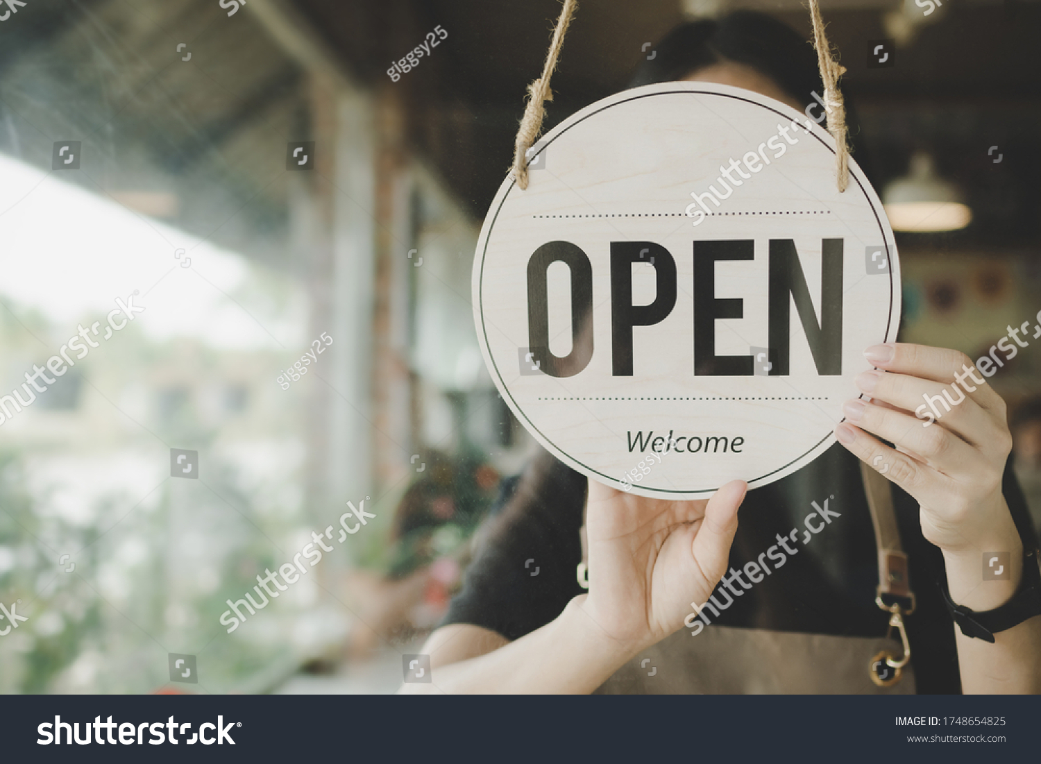 Welcome. Open. barista, waitress woman turning open sign board on glass door in modern cafe coffee shop ready to service, cafe restaurant, retail store, small business owner, food and drink concept #1748654825