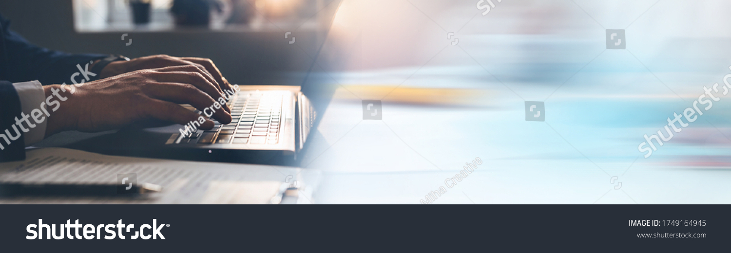 Businessman working on laptop. Panoramic business banner with copy space. #1749164945