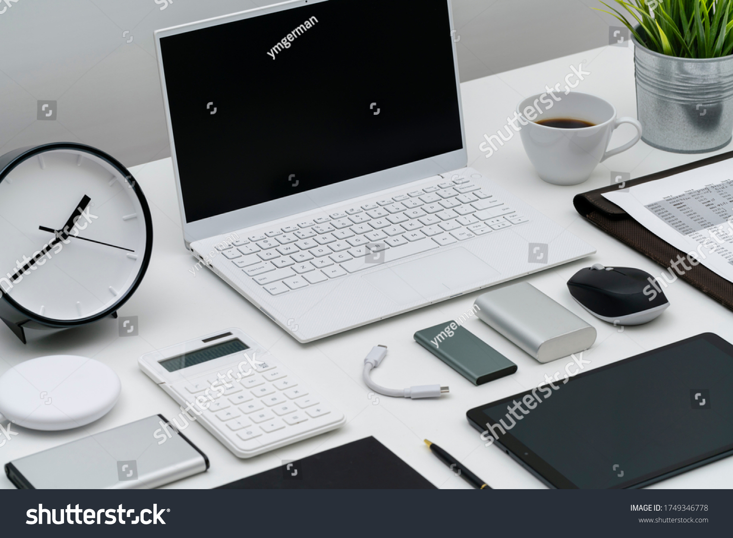 Flat lay of office desktop and gadgets at an angle #1749346778
