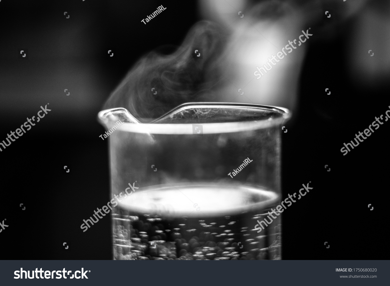 Water evaporation experiment on glass beaker black and white #1750680020