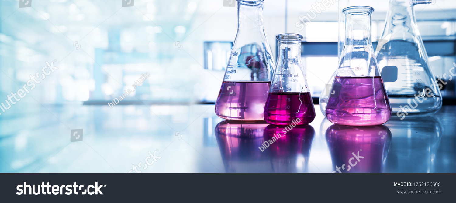 purple glass flask in blue research chemistry science banner laboratory background  #1752176606