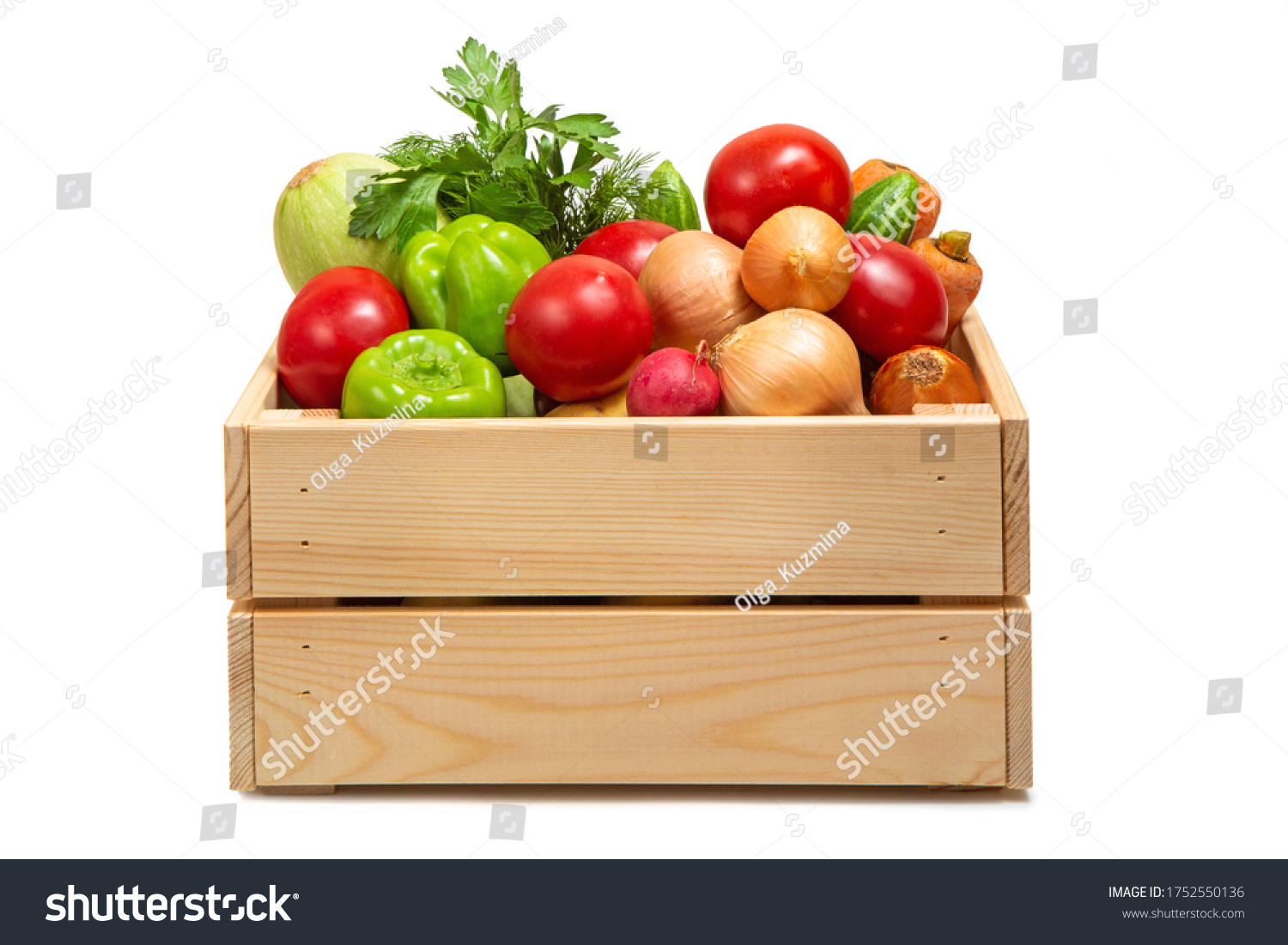 Wooden box with vegetables on a white background. Zucchini, carrots, tomatoes, cucumbers and greens. Fresh vegetables. Agricultural Products. Delivery of products. #1752550136
