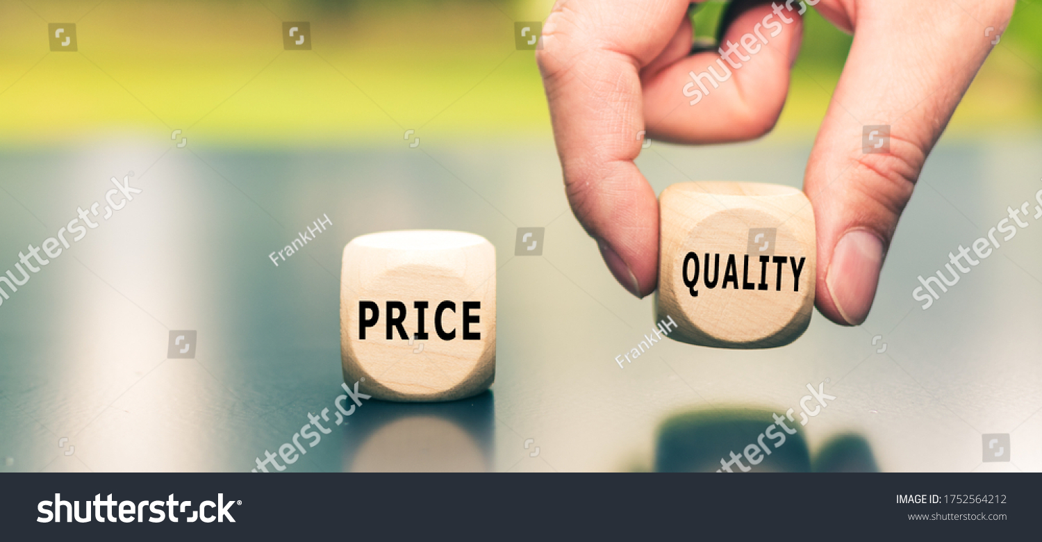 Price versus Quality. The cube with the word "quality" is selected by a hand. #1752564212