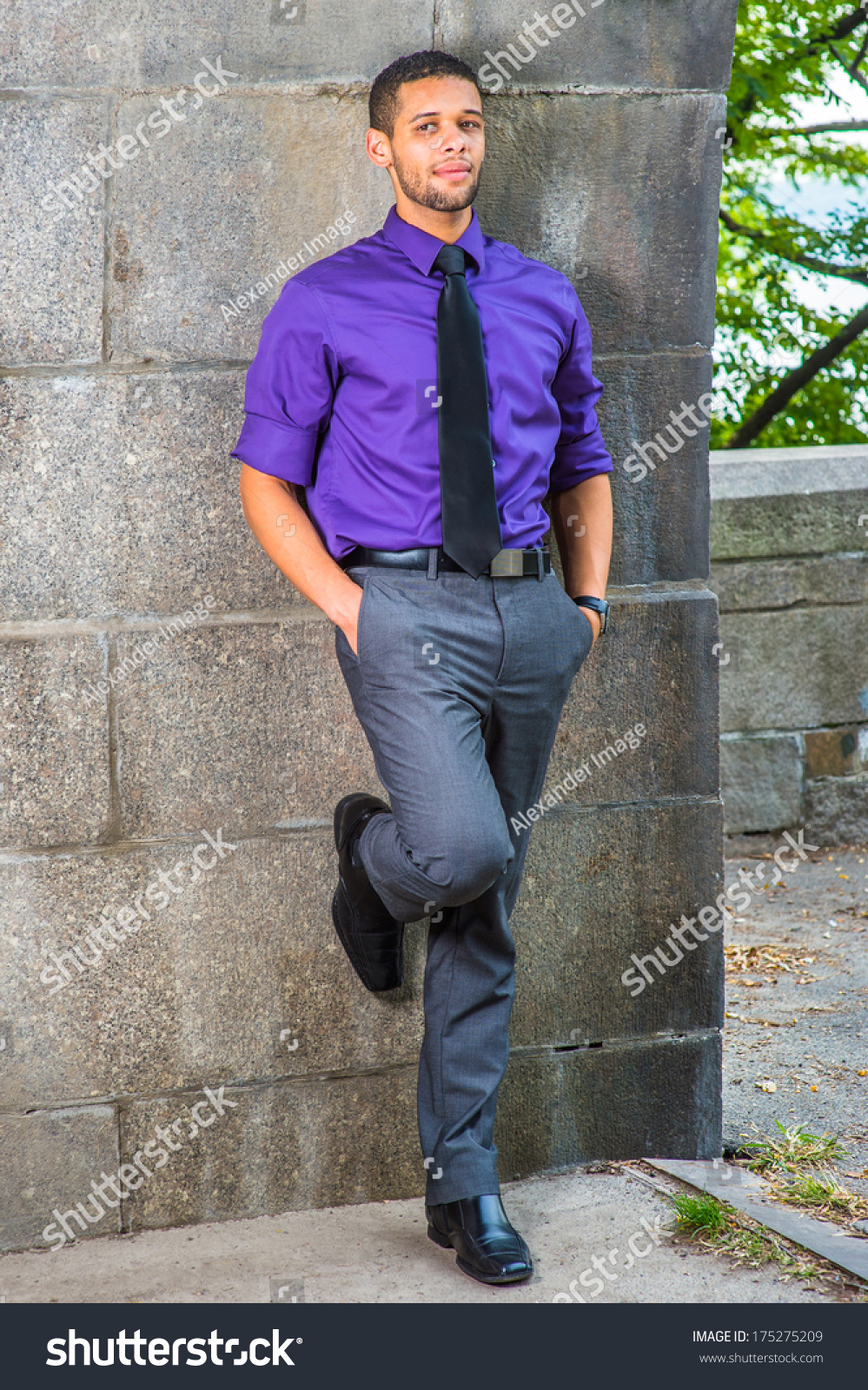 purple shirt and gray pants